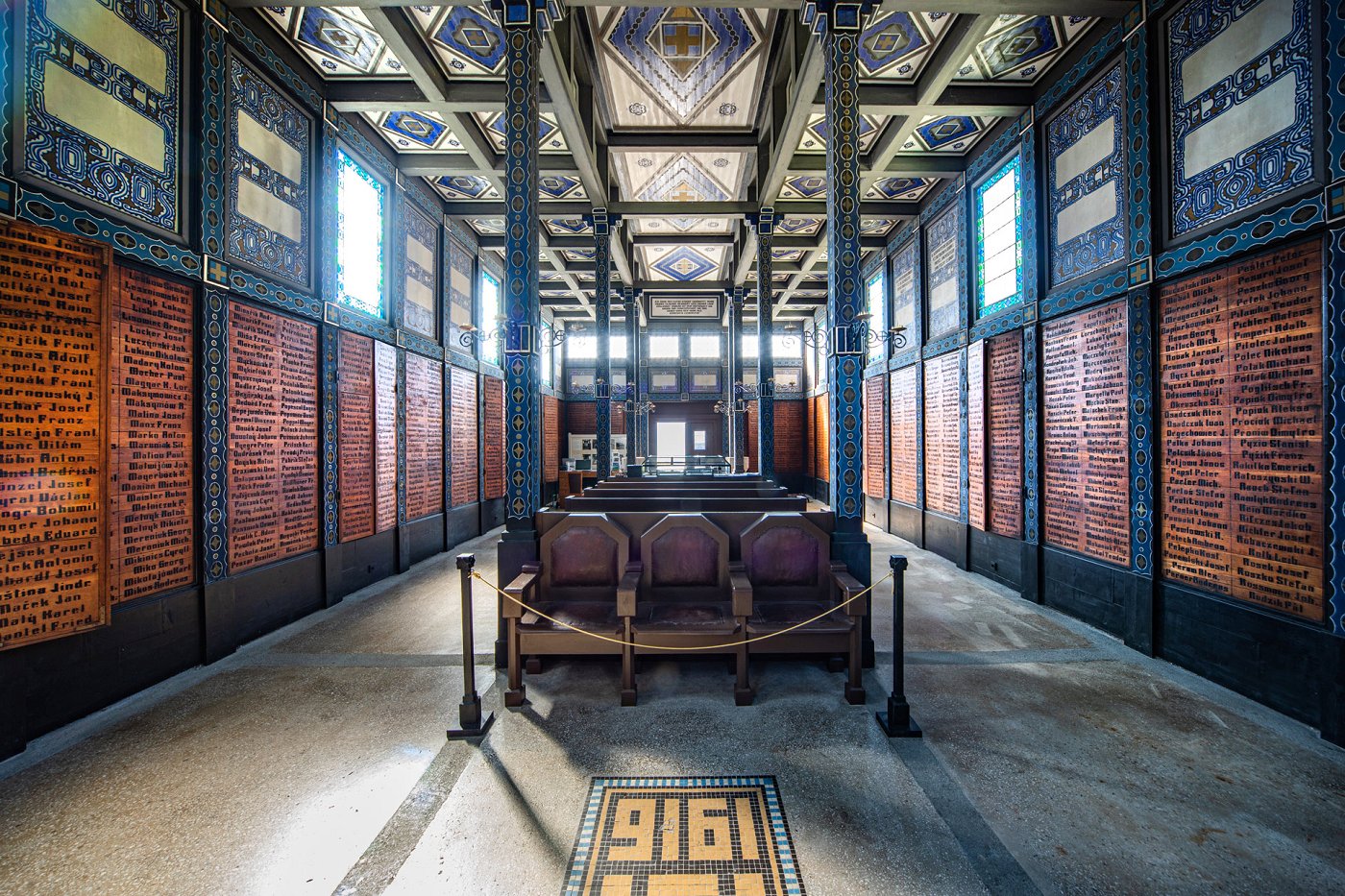The interior of the church with many oak panels with names of fallen soldiers