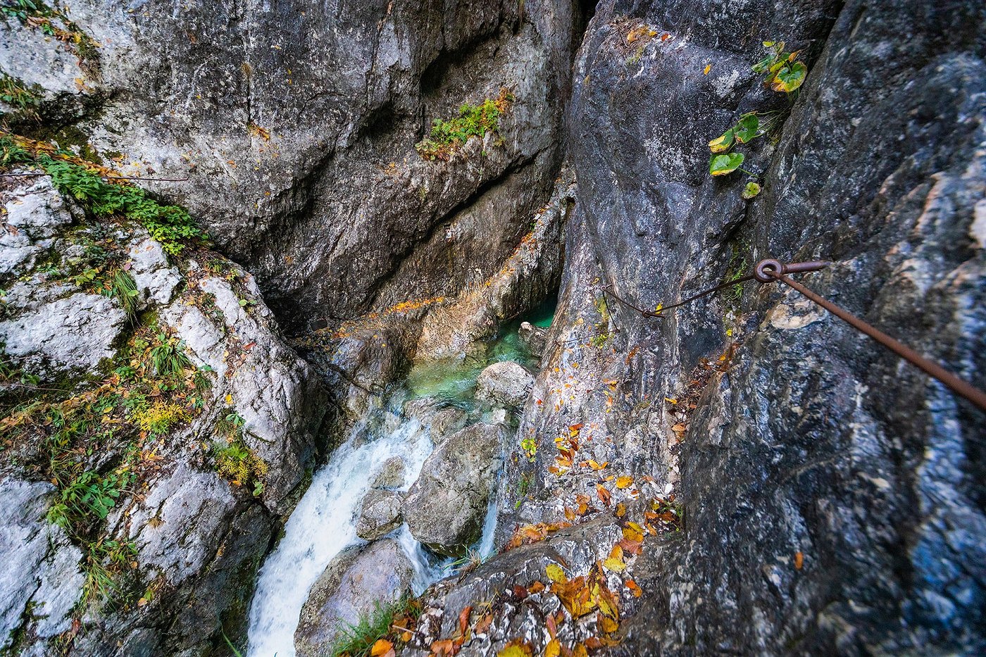 The karst source of the emerald river Soča, which is reached with the help of a steel cable.